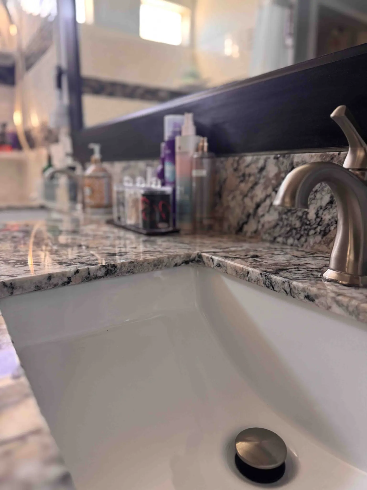 Polished bathroom sink and counter detail